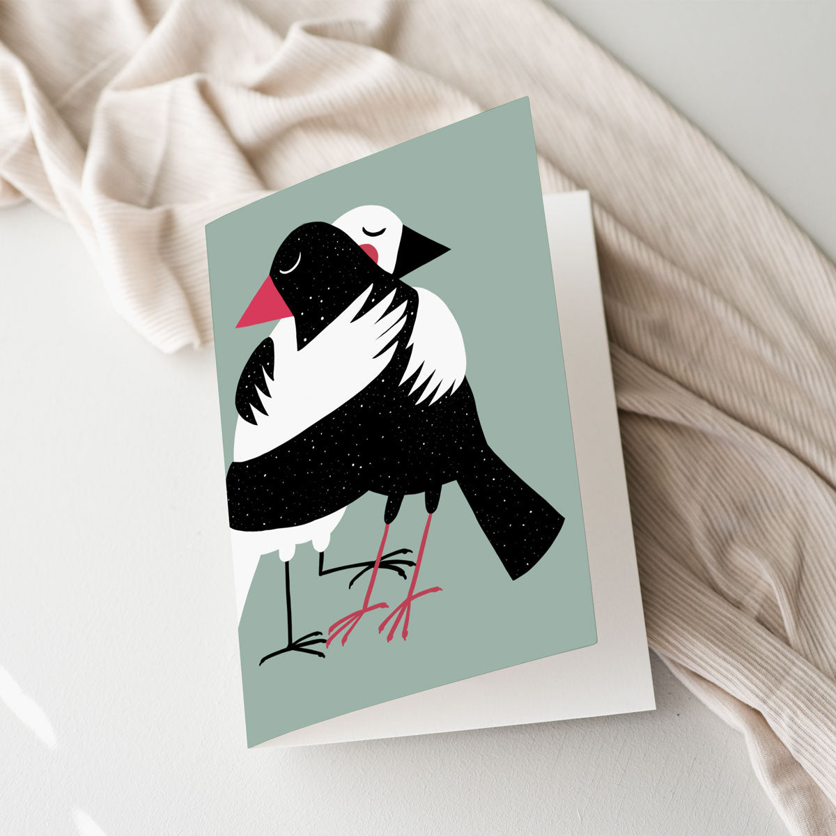 Bird art card with a whimsical illustration of two birds hugging, perfect for any occasion