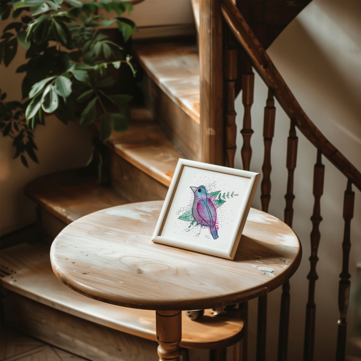 A colorful and whimsical watercolor bird painting resting on a little wooden table