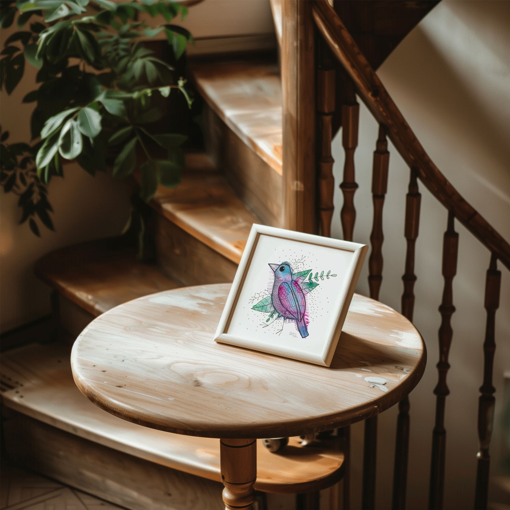 A colorful and whimsical watercolor bird painting resting on a little wooden table